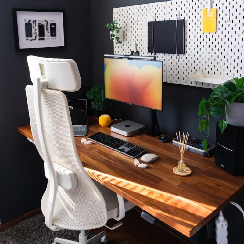 a-desk-with-a-computer-and-a-keyboard